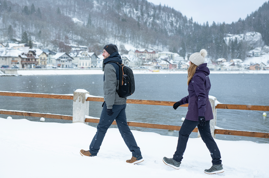 Man and woman hiking in the snow