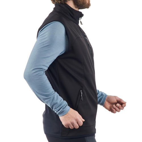 A photo of the Quechua Trek 500 Softshell Hiking Windbreaker Vest Men's in use