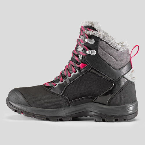 A photo of the Women's Warm and Waterproof Hiking Boots - SH500 mountain MID in use