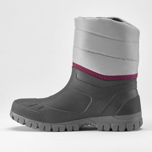 A photo of the Women's warm waterproof snow hiking boots - SH100 mid in use