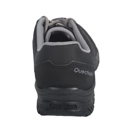 A photo of the Quechua Men's NH100 Hiking Boots in use