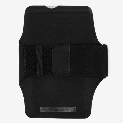 A photo of the KIPRUN Women's Running Smartphone Armband - Black in use