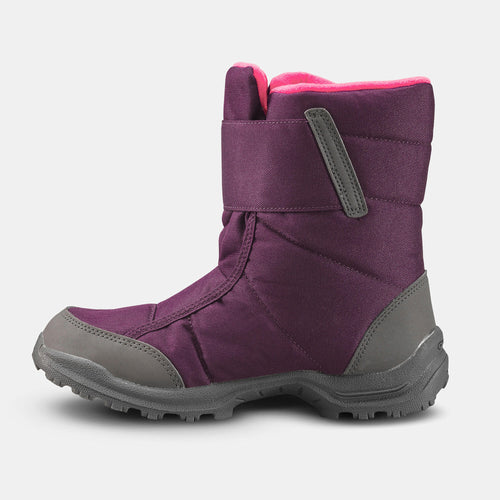 A photo of the Kids' warm waterproof snow hiking boots SH100 - Velcro Size 7 - 5.5 in use