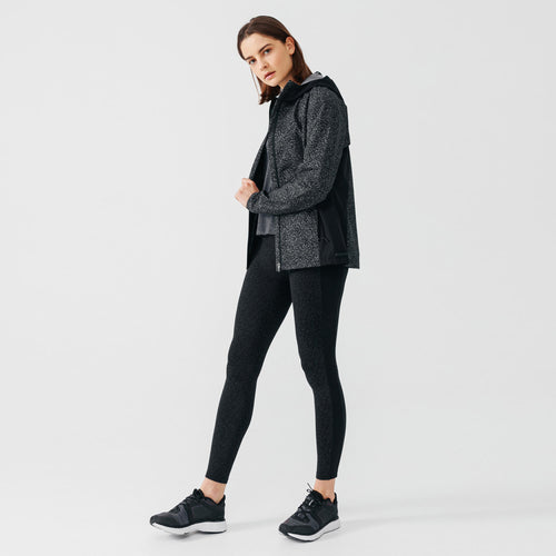 A photo of the Kalenji Women's Running Rain Jacket in use