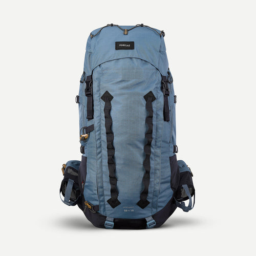A photo of the Forclaz Women's MT900 Symbium 50+10 L Backpacking Pack in use