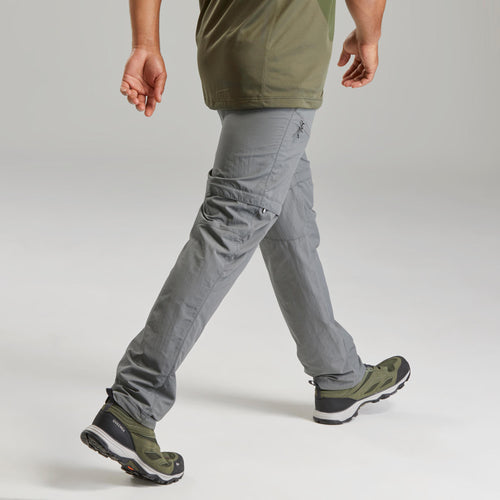 A photo of the Quechua MH150 Convertible Hiking Pants Men's in use