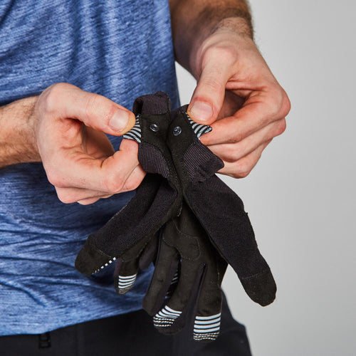 A photo of the ST 100 Mountain Bike Gloves - Black in use