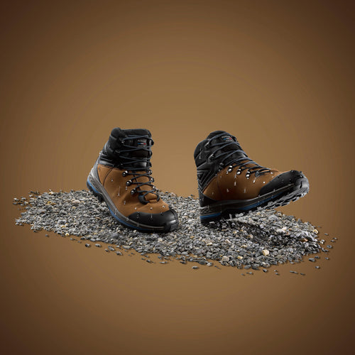A photo of the Forclaz Trek 100 Flexible Leather Hiking Boots Men's in use