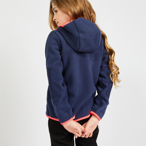 A photo of the Tribord 500 Reversible Sailing Fleece Kids' in use