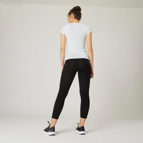 A photo of the Women's Fitness 7 8 Leggings Fit+ 500 - Black in use