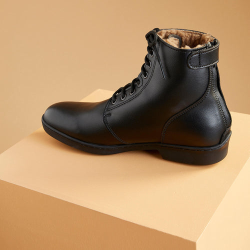 A photo of the Adult Horseback Riding Warm Lace-Up Riding Boots 500 in use