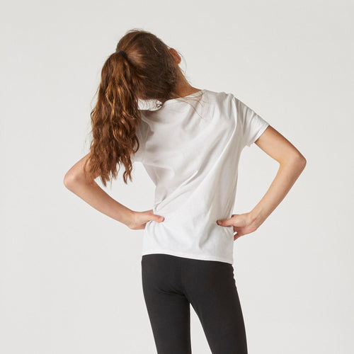 A photo of the Kids' Unisex Cotton T-Shirt - White in use