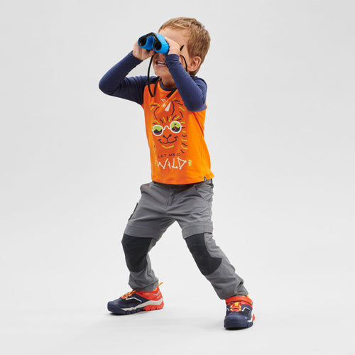 A photo of the Quechua MH500 Convertible Hiking Pants Kids' in use