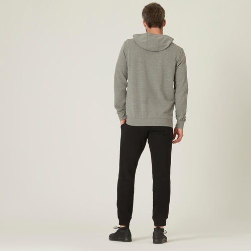 A photo of the Men's Warm Fitness Jogging Bottoms 100 - Black in use