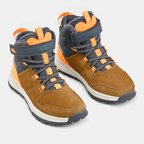 A photo of the Children's warm waterproof hiking boots - SH500 leather Velcro - size 7 - 2 in use
