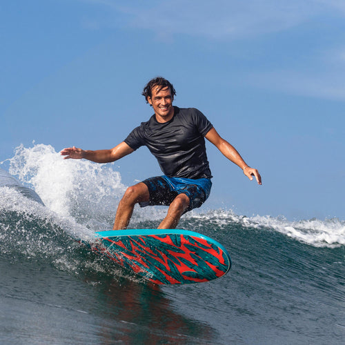A photo of the Olaian Rashguard UV Protection UPF 50+ Short Sleeve T-Shirt Men in use