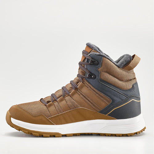 A photo of the Quechua Men's SH100 X-Warm Waterproof Hiking Boots in use
