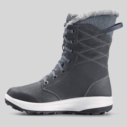 A photo of the Women's warm and waterproof leather hiking boots - SH900 high-top in use