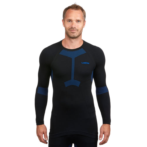 A photo of the Men's Seamless Ski Base Layer Top BL 580 I-Soft – Black Blue in use