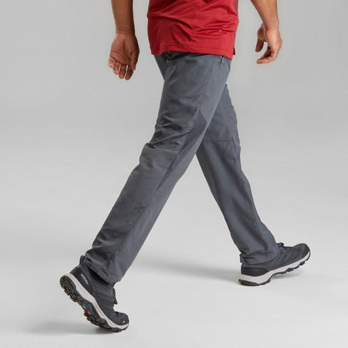 A photo of the Quechua MH100M Hiking Pants Men's in use