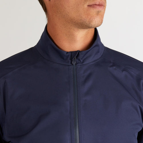 A photo of the Men's golf waterproof rain jacket - RW500 navy blue in use