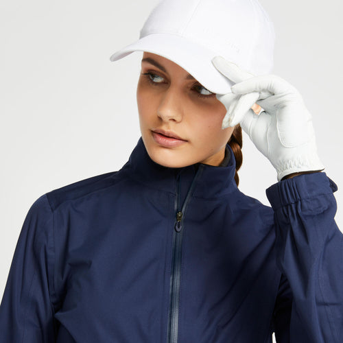 A photo of the Women's golf waterproof rain jacket - RW500 navy blue in use