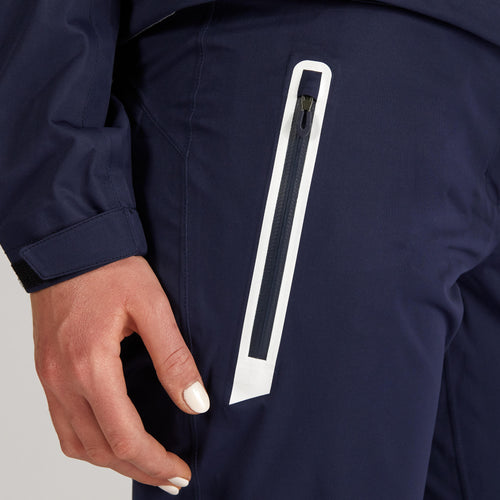 A photo of the Women's golf waterproof Pants - RW500 navy blue in use