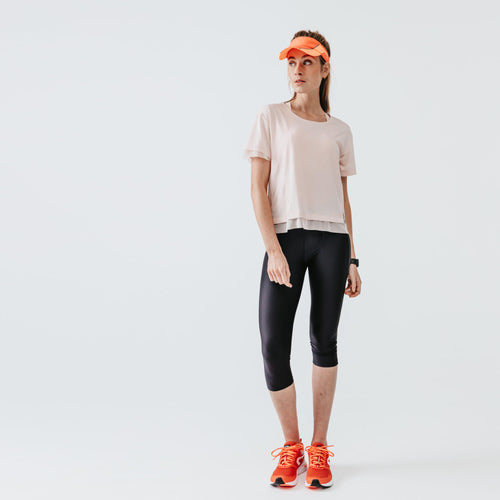 A photo of the Women's Running Short Leggings - Kiprun Run 100 Black in use