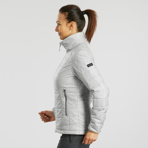 A photo of the Forclaz Women's MT100 Synthetic Puffer Jacket in use