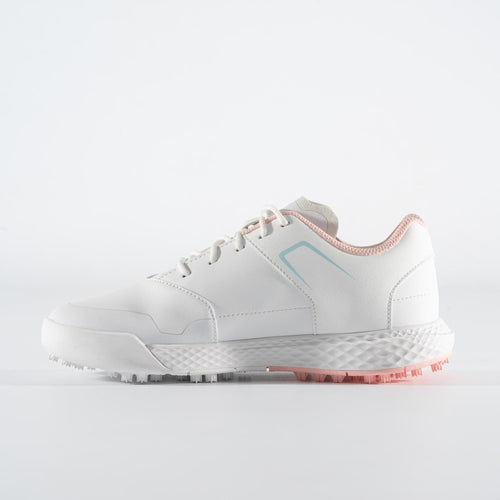 A photo of the GIRL'S GOLF SHOES WATERPROOF GRIP - WHITE AND PINK in use