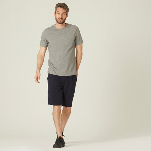 A photo of the Nyamba 500 Stretch Cotton Fitness T-Shirt Men's in use