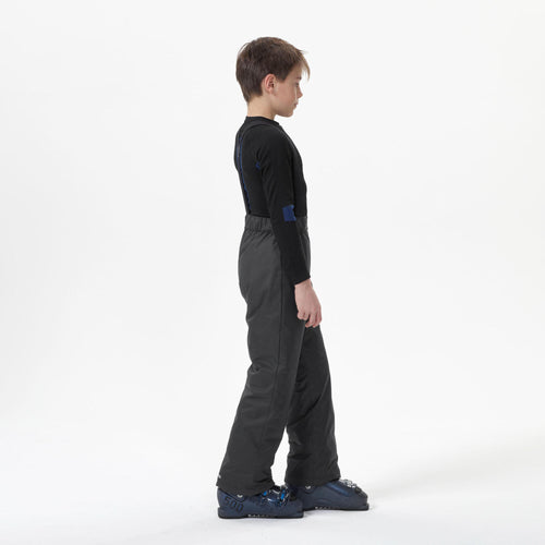 A photo of the KIDS' WARM AND WATERPROOF SKI Pants 100 DARK GREY in use
