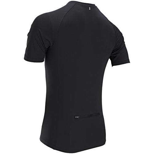 A photo of the Triban Essential Moisture-Wicking Short Sleeved Road Cycling Jersey Men's in use