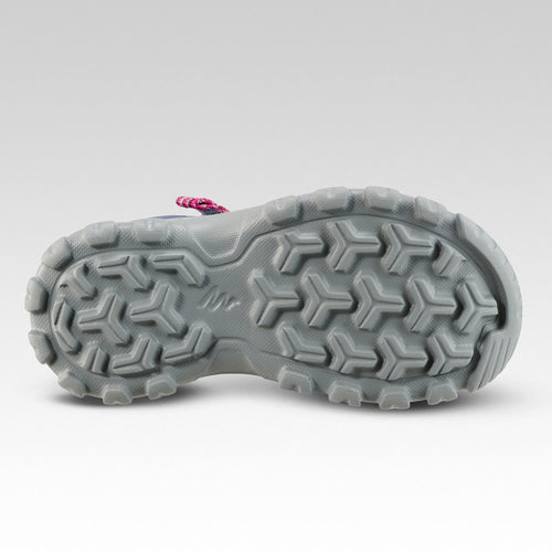 A photo of the Quechua MH100 Hiking Sandals Kids' in use