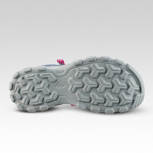 A photo of the Quechua MH100 Hiking Sandals Kids' in use