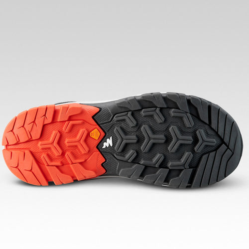 A photo of the Quechua Crossrock Mid Waterproof Lace-Up Hiking Shoes Kids' in use