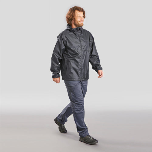 A photo of the Quechua Men's Raincut Zip Windproof and Water-repellent Jacket in use