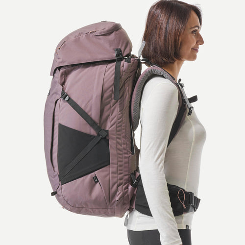 A photo of the Women's Travel Backpacking Backpack with Suitcase Opening Travel 900 60+6 L in use