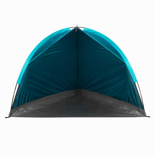 A photo of the Quechua Arpenaz Compact Sunshade Shelter Beach Tent in use