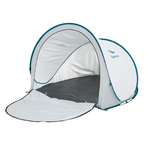 A photo of the Quechua 2" Pop-up Extra Large Camping Beach Shelter Cool & Blackout in use