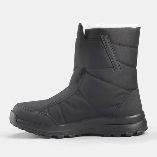 A photo of the Quechua Women's SH100 X-Warm Waterproof Mid Snow Boots in use