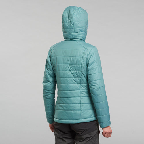 A photo of the Forclaz Women's MT100 Hooded Synthetic Jacket in use