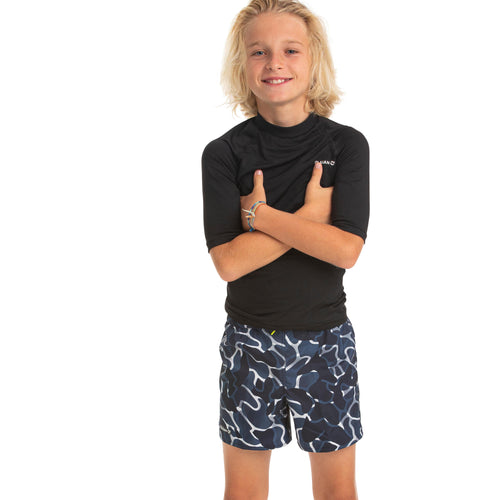 A photo of the Olaian 100 Surfing Boarshorts Kids' in use