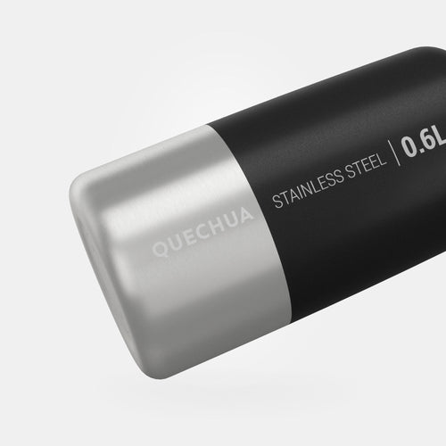 A photo of the Quechua MH100 Stainless Steel Screw Cap Hiking Water Bottle 20oz in use