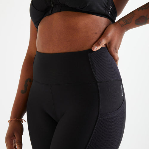 A photo of the Women's Fitness Cardio Leggings with Phone Pocket - Black in use