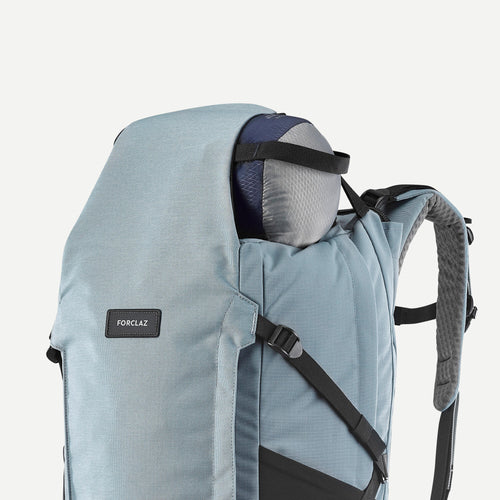 A photo of the Forclaz Women's Travel 900 50+6L Backpacking Pack in use