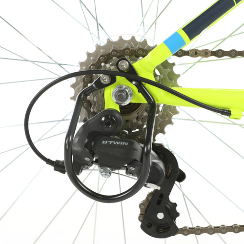 A photo of the Rockrider ST500 Mountain Bike 24" Kids 4'5" to 4'11" in use