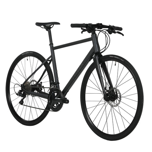 A photo of the Triban RC500 Shimano Sora Disc Brake Flat Bar Road Bike in use