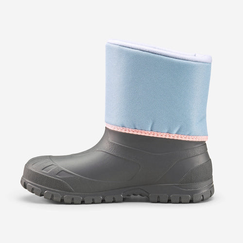 A photo of the CHILDREN'S WARM WATERPROOF HIKING SNOW BOOTS- SH100 - KIDS' 8C - 4 in use
