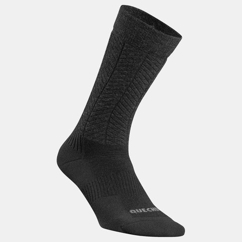 A photo of the Quechua SH500 Mid 2-Pair Winter Hiking Warm Socks in use